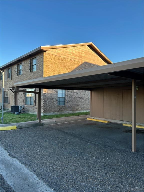 view of parking featuring a carport