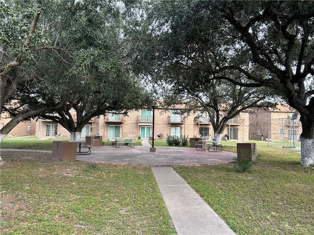 view of home's community with a yard