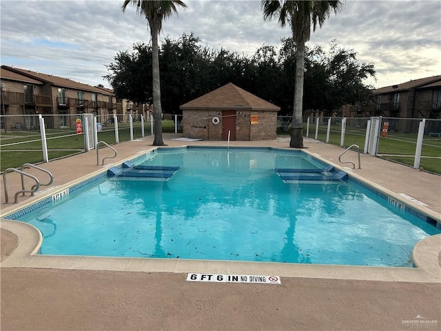 view of swimming pool with a patio area