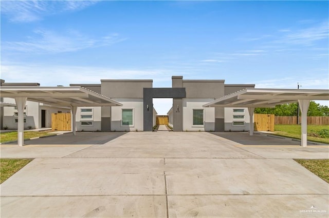 contemporary home featuring a carport