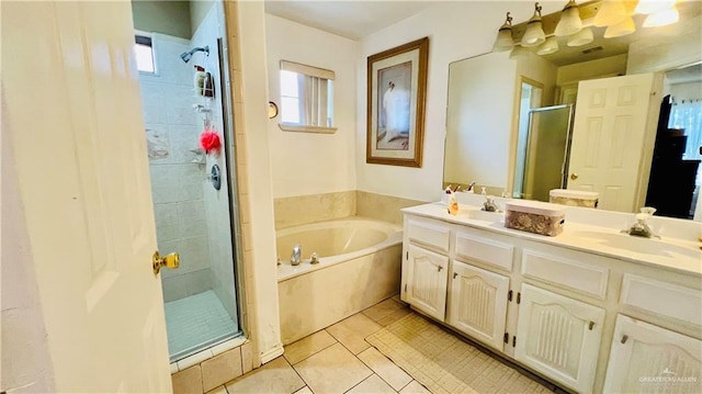 6916 Avenida Del Paseo St, Mission, TX 78572 - full bath featuring a shower stall, double vanity, a garden tub, and tile patterned floors