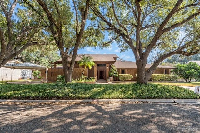 1502 Betty Dr, Mission, TX 78572 - single story home with a carport