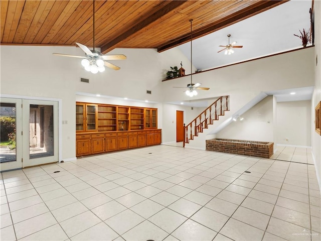 1502 Betty Dr, Mission, TX 78572 - unfurnished living room featuring ceiling fan, stairway, a wood ceiling with exposed beams, light tile patterned floors, and high vaulted ceiling