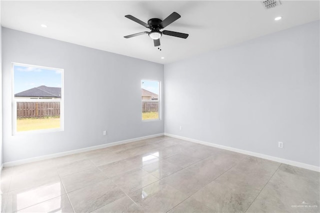 empty room featuring ceiling fan