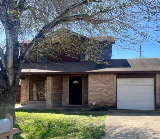 view of front of property with a garage, concrete driveway, and a front yard