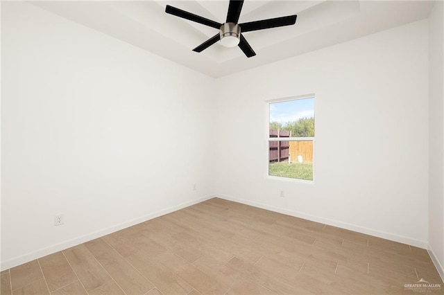 spare room with light hardwood / wood-style flooring and ceiling fan