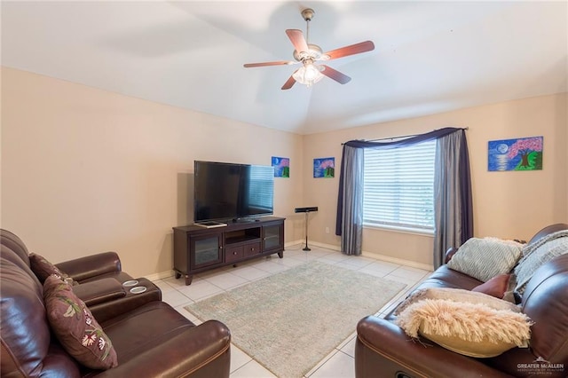 tiled living room with ceiling fan and lofted ceiling