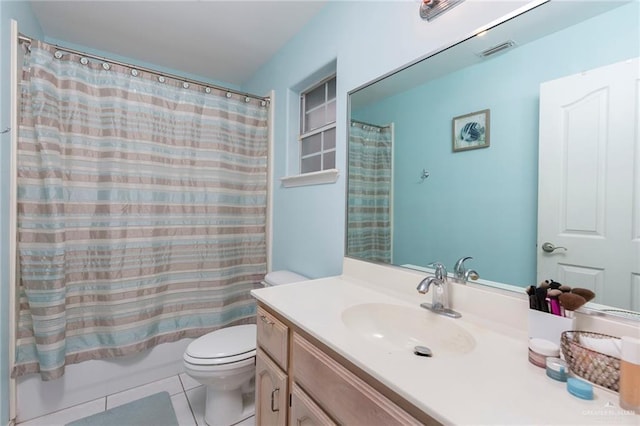 full bathroom with vanity, tile patterned floors, toilet, and shower / bath combo with shower curtain