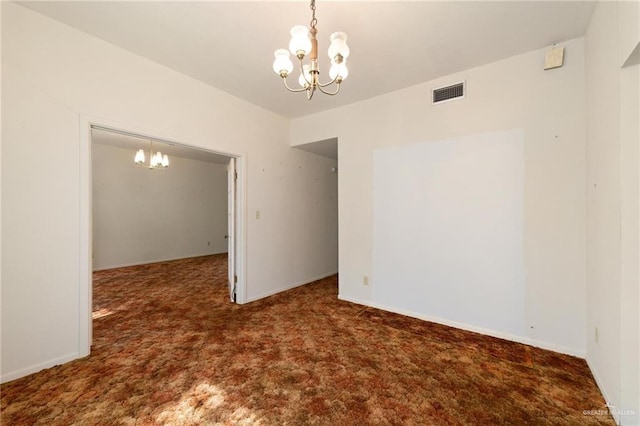 empty room featuring baseboards, carpet flooring, a chandelier, and visible vents
