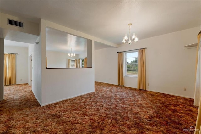 empty room with visible vents, carpet flooring, and a notable chandelier