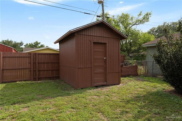 view of shed featuring a fenced backyard