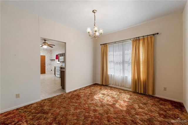 carpeted spare room with wallpapered walls, baseboards, and ceiling fan with notable chandelier