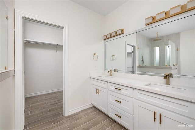 bathroom with a shower and vanity