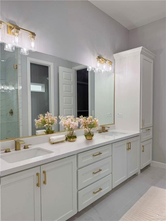 bathroom featuring tile patterned floors, vanity, and walk in shower