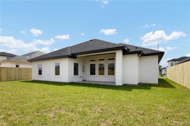 1008 N Buxton Ave, Edinburg, TX 78541 - rear view of property with stucco siding and roof with shingles