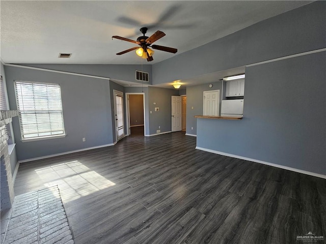 unfurnished living room with ceiling fan, dark wood-type flooring, a brick fireplace, and vaulted ceiling