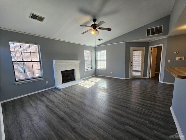 unfurnished living room with lofted ceiling, plenty of natural light, ceiling fan, and dark hardwood / wood-style floors