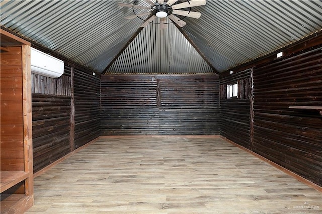 storage room featuring ceiling fan and an AC wall unit