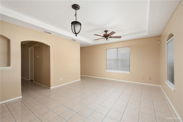 unfurnished room with ceiling fan and light tile patterned flooring