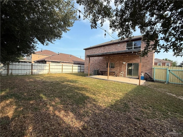 1341 Kokopelli Dr, Edinburg, TX 78541 - rear view of house featuring a patio, brick siding, a gate, and cooling unit