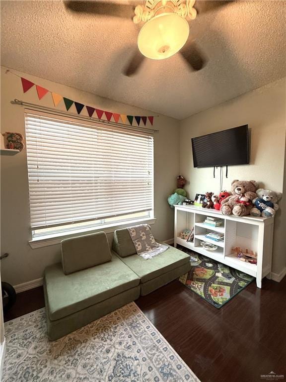 1341 Kokopelli Dr, Edinburg, TX 78541 - living room with a textured ceiling, wood finished floors, and baseboards