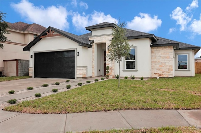 2427 Summer Breeze St, Mission, TX 78572 - view of front of house with stone siding, concrete driveway, a garage, stucco siding, and a front lawn