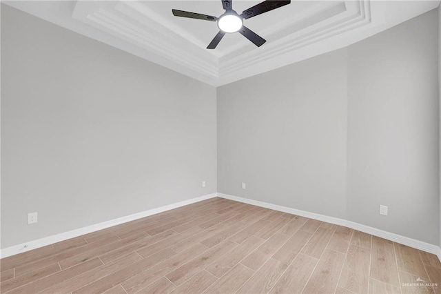 2427 Summer Breeze St, Mission, TX 78572 - spare room with a raised ceiling, light wood-type flooring, and ceiling fan