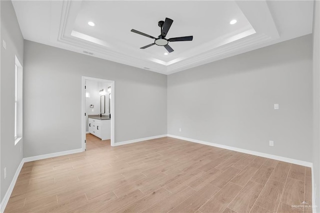 2427 Summer Breeze St, Mission, TX 78572 - empty room featuring a tray ceiling, ceiling fan, light wood-style floors, and recessed lighting