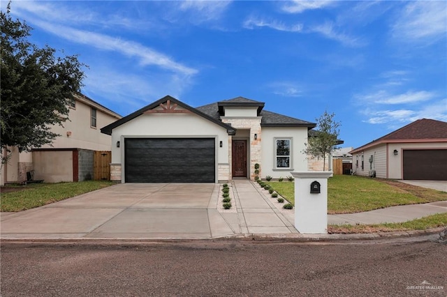 2427 Summer Breeze St, Mission, TX 78572 - view of front of property featuring stucco siding, driveway, stone siding, a garage, and a front yard