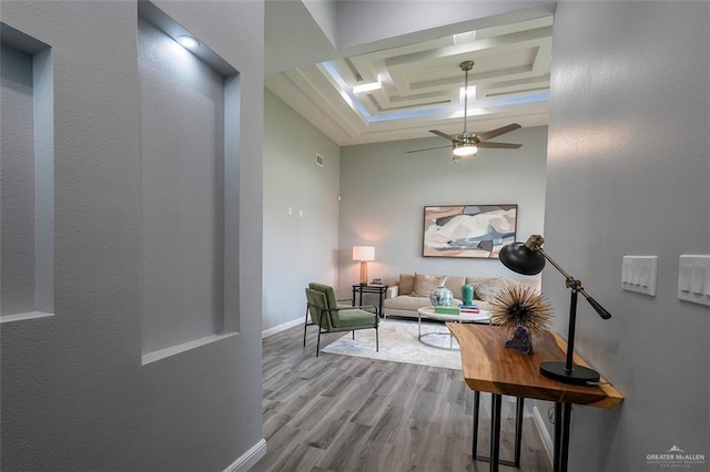 3005 E Q Ave, Hidalgo, TX 78557 - living room featuring wood finished floors, a raised ceiling, and a ceiling fan