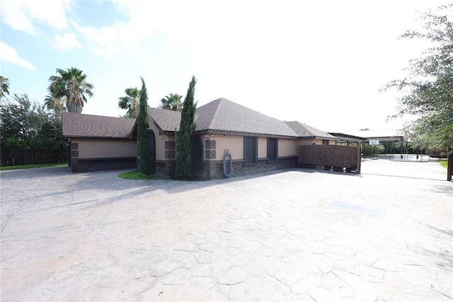 5310 Nicole Dr, Edinburg, TX 78542 - view of property exterior with stucco siding and driveway