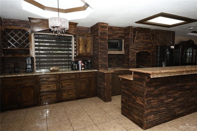 5310 Nicole Dr, Edinburg, TX 78542 - indoor wet bar with freestanding refrigerator, light tile patterned floors, stainless steel microwave, a tray ceiling, and ornamental molding