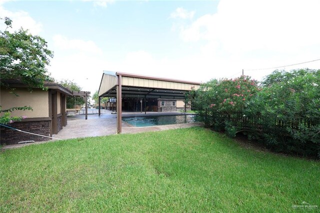 5310 Nicole Dr, Edinburg, TX 78542 - view of grassy yard with a patio and an outdoor pool