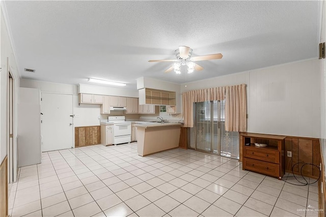 kitchen with wood walls, kitchen peninsula, white range with electric cooktop, a textured ceiling, and light tile patterned floors