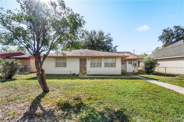 ranch-style home with a front yard