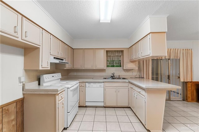 kitchen featuring a textured ceiling, light tile patterned floors, kitchen peninsula, and white appliances