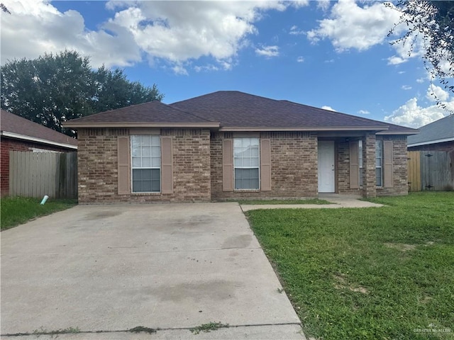 914 Denver St, Edinburg, TX 78541 - view of front of property with brick siding and roof with shingles