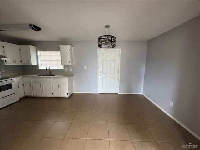 914 Denver St, Edinburg, TX 78541 - kitchen featuring electric stove, tile patterned flooring, white cabinets, and light countertops