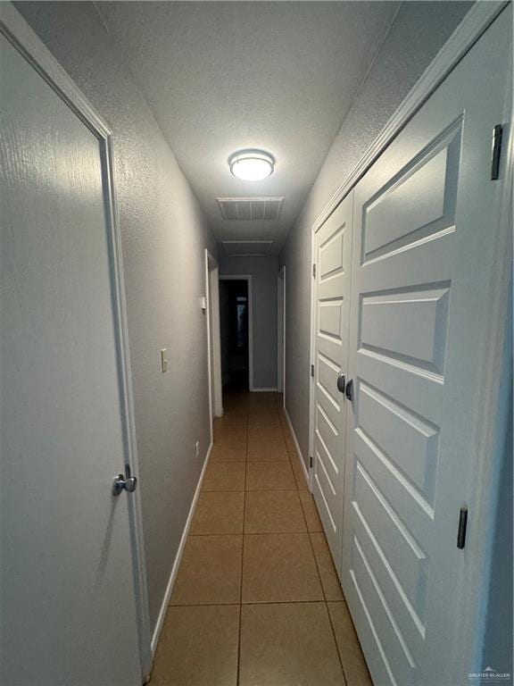 914 Denver St, Edinburg, TX 78541 - hallway with tile patterned flooring and baseboards