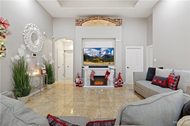 living room featuring a towering ceiling