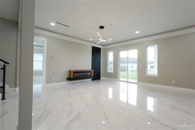 unfurnished living room featuring ornamental molding and a chandelier