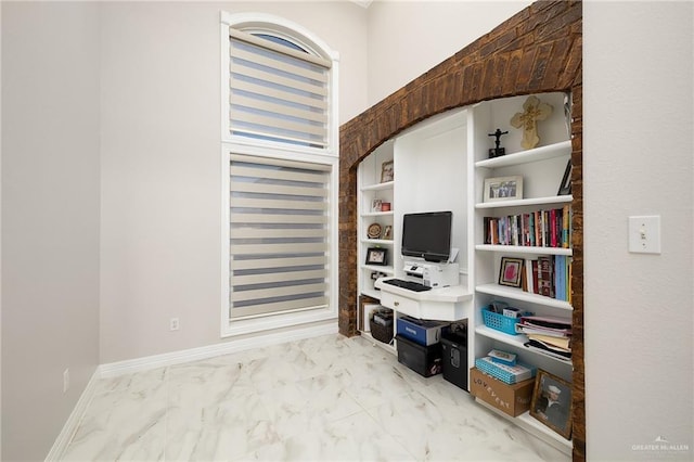 office area featuring marble finish floor and baseboards