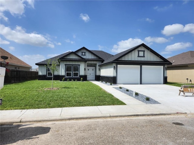 411 Thornwood Loop, Rio Grande City, TX 78582 - view of front of property with an attached garage, driveway, and board and batten siding