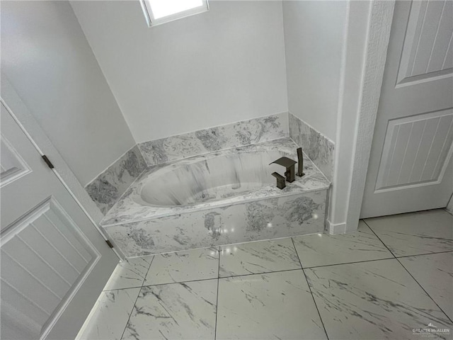 411 Thornwood Loop, Rio Grande City, TX 78582 - full bathroom with marble finish floors and a garden tub