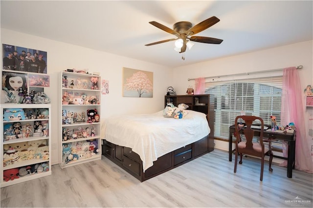 bedroom with ceiling fan and light wood-type flooring