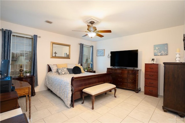 bedroom featuring light tile patterned floors and ceiling fan