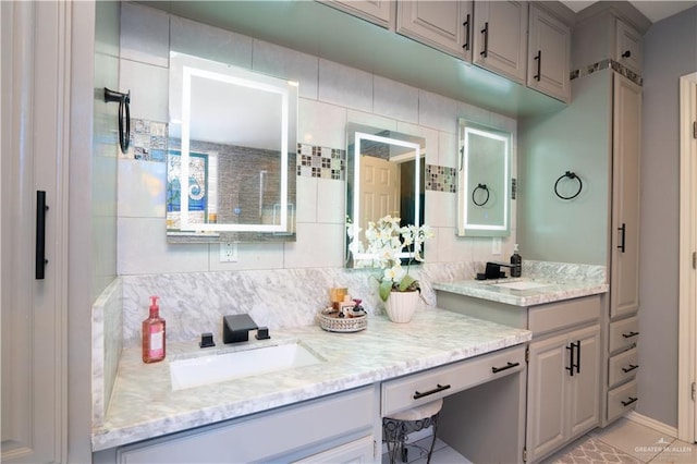 bathroom featuring vanity and decorative backsplash