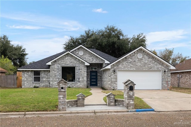 view of front of house featuring a garage and a front lawn