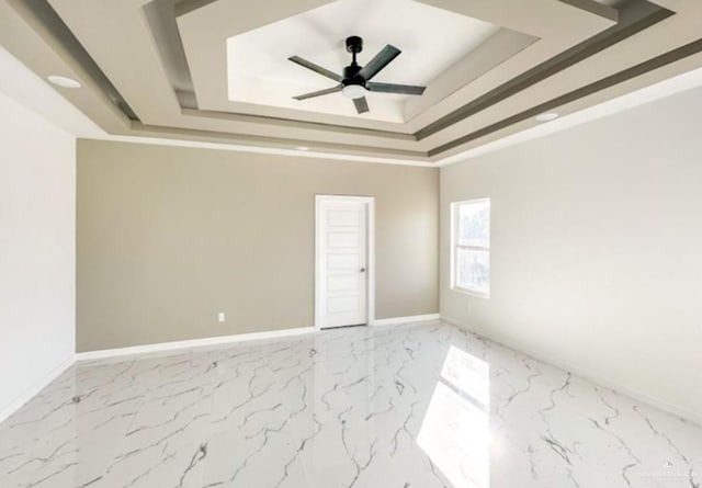 3011 E Ebano Ave, Hidalgo, TX 78557 - spare room with a tray ceiling, marble finish floors, and a ceiling fan