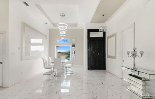3011 E Ebano Ave, Hidalgo, TX 78557 - entryway featuring a tray ceiling and marble finish flooring